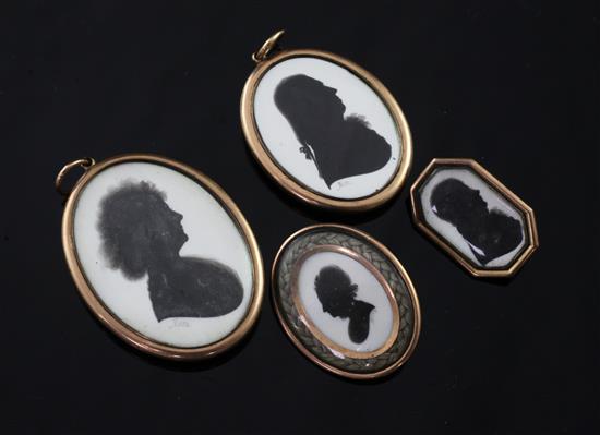 Two late 18th/early 19th century gold mounted silhouette pendants and two brooches